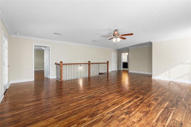 unfurnished room with ceiling fan, dark hardwood / wood-style flooring, and ornamental molding