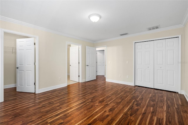 unfurnished bedroom featuring dark hardwood / wood-style flooring and ornamental molding