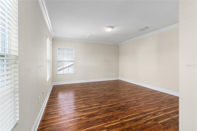 unfurnished room featuring a textured ceiling, dark hardwood / wood-style floors, and ornamental molding