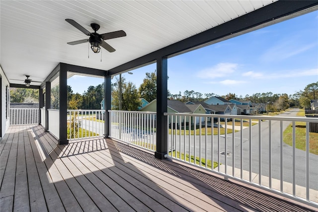 wooden terrace featuring ceiling fan