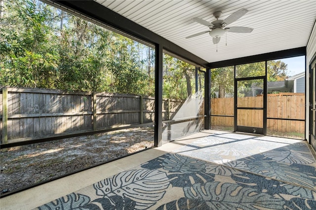 sunroom / solarium featuring ceiling fan