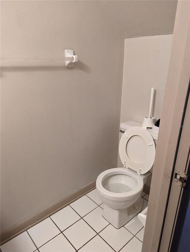 bathroom featuring tile patterned floors and toilet