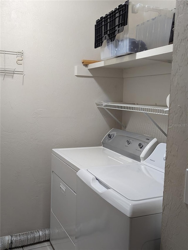 washroom with washing machine and dryer