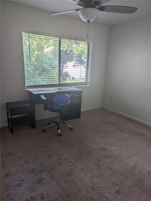 unfurnished office with carpet floors and ceiling fan