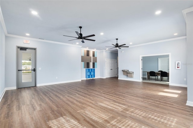 unfurnished living room with light hardwood / wood-style flooring, ceiling fan, and ornamental molding