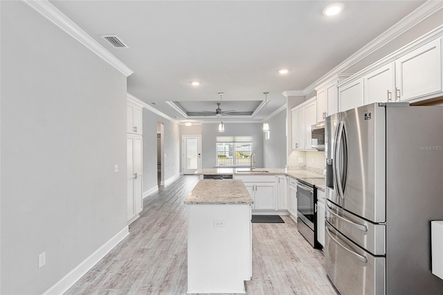 kitchen featuring kitchen peninsula, appliances with stainless steel finishes, light wood-type flooring, ceiling fan, and white cabinets