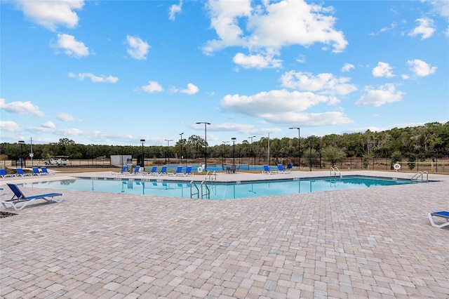 view of swimming pool featuring a patio area