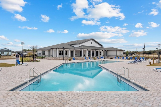 view of swimming pool featuring a patio area