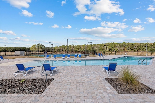 view of swimming pool featuring a patio area