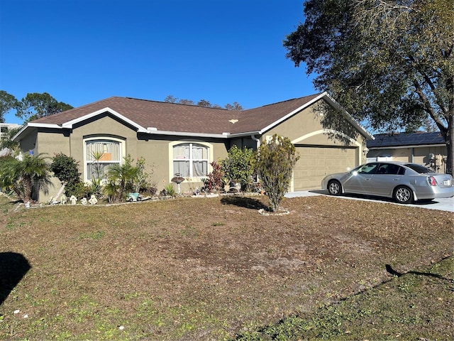 single story home featuring a garage