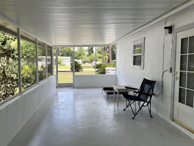 unfurnished sunroom featuring plenty of natural light