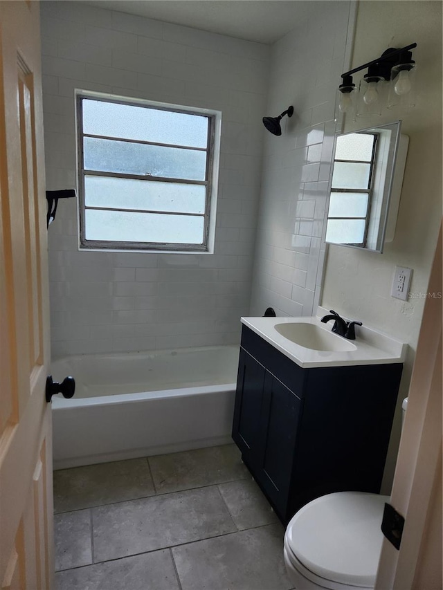 full bathroom featuring vanity, toilet, and tiled shower / bath combo