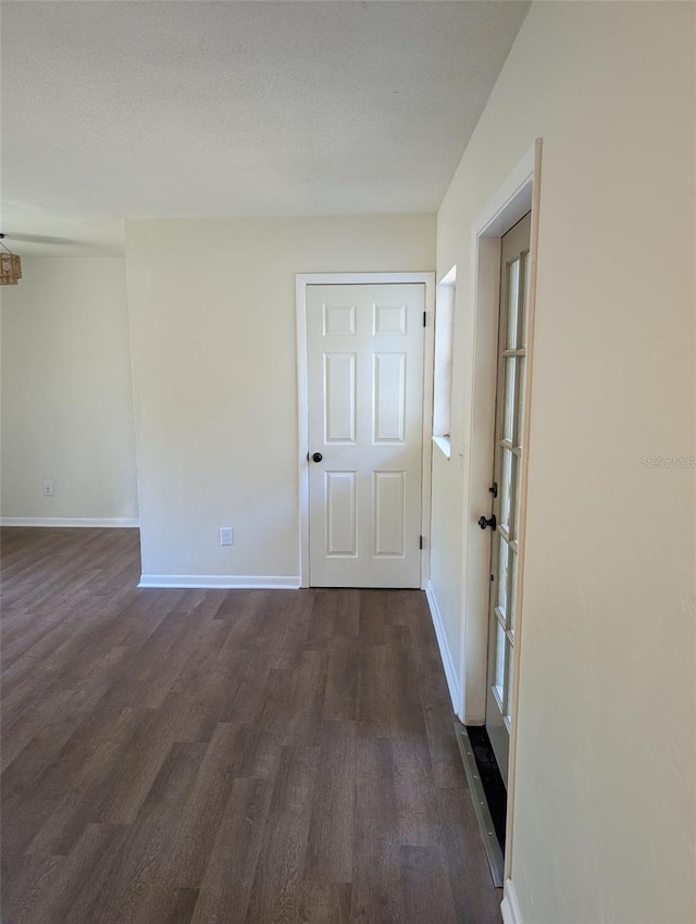 spare room featuring dark hardwood / wood-style floors