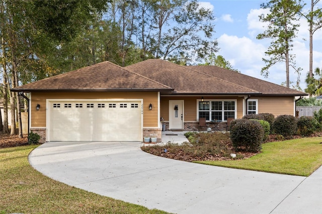 view of front facade with a front lawn and a garage