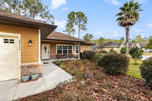 view of exterior entry with a garage