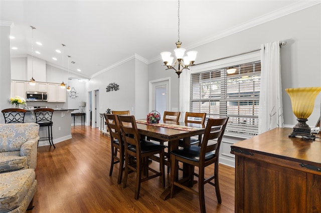 dining area featuring hardwood / wood-style flooring, a chandelier, vaulted ceiling, and ornamental molding