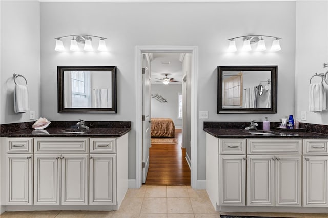 bathroom with vanity, ceiling fan, and tile patterned flooring