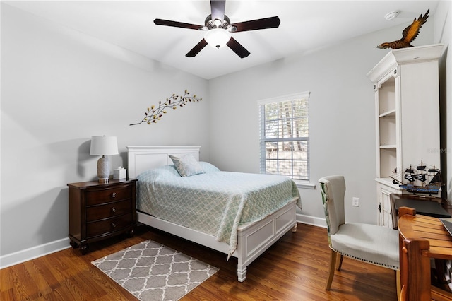 bedroom with ceiling fan and dark hardwood / wood-style flooring