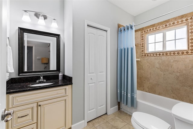 full bathroom featuring tile patterned floors, toilet, vanity, and shower / bath combination with curtain