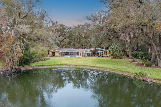 exterior space with a lawn and a water view