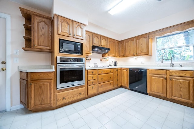 kitchen with sink and black appliances