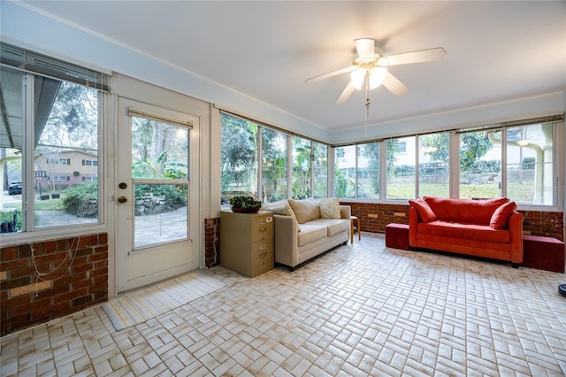 sunroom with ceiling fan and a healthy amount of sunlight