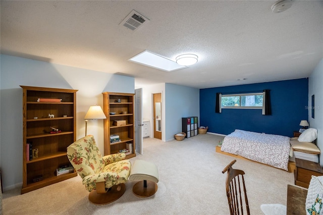 carpeted bedroom featuring a textured ceiling