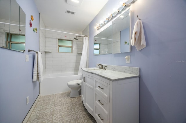 full bathroom featuring tile patterned flooring, shower / bath combo, vanity, and toilet