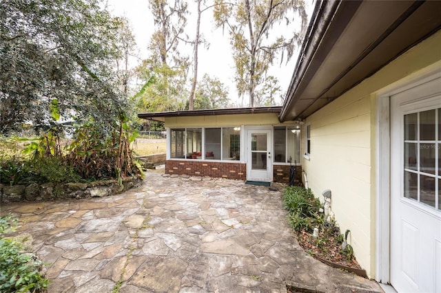 view of patio / terrace with a sunroom