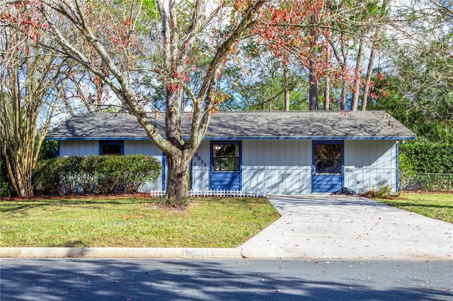 ranch-style house with a front lawn