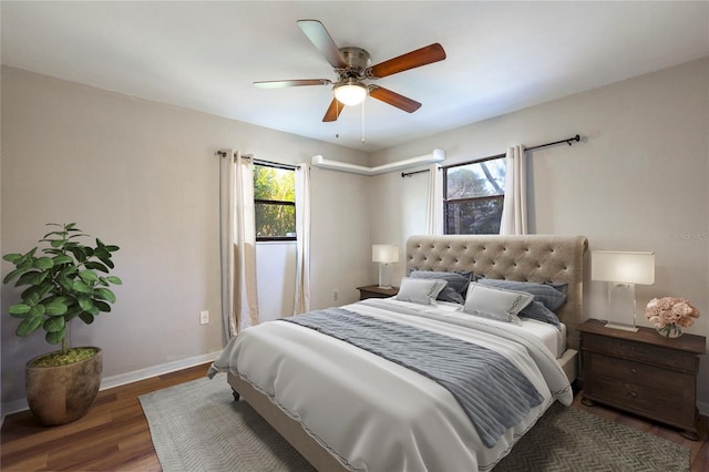 bedroom featuring ceiling fan and dark hardwood / wood-style flooring