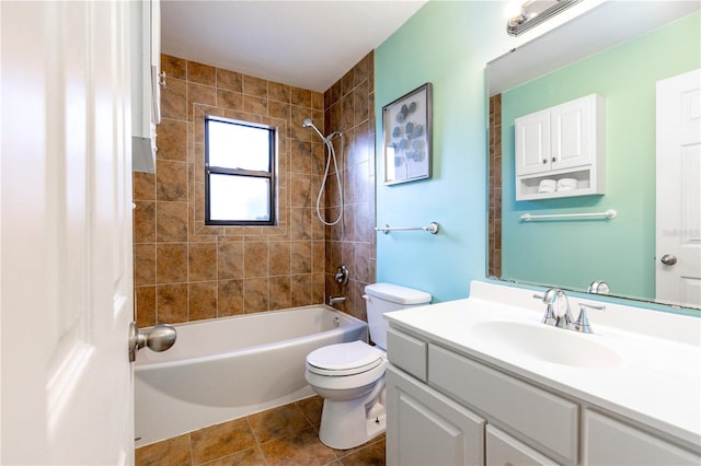 full bathroom featuring tile patterned floors, toilet, vanity, and tiled shower / bath