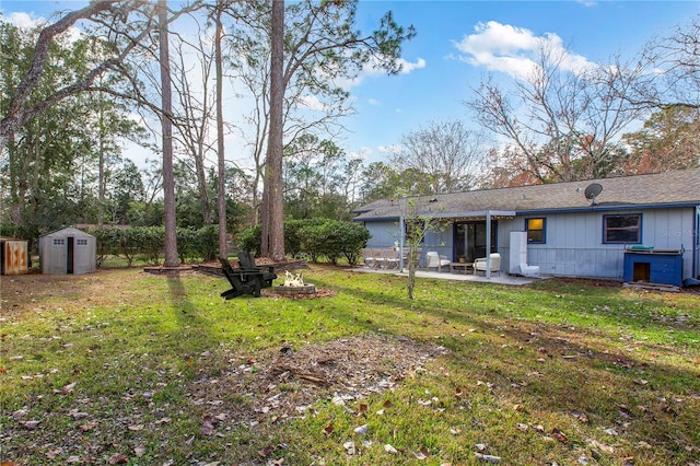 view of yard with a patio area and a storage shed