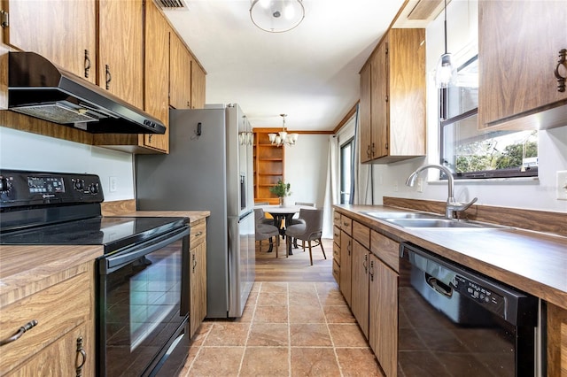 kitchen featuring ornamental molding, sink, black appliances, decorative light fixtures, and an inviting chandelier