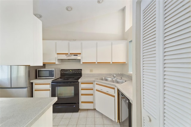 kitchen featuring light tile patterned flooring, appliances with stainless steel finishes, white cabinetry, and sink