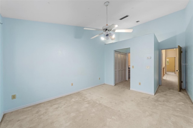 unfurnished bedroom with ceiling fan and light carpet