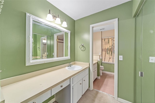 bathroom with hardwood / wood-style flooring, vanity, and toilet