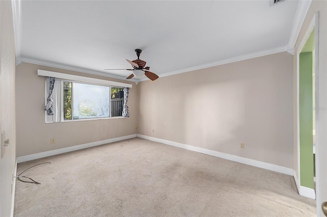 carpeted empty room with crown molding and ceiling fan