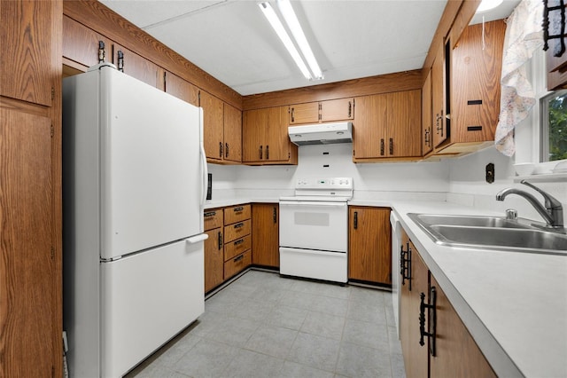 kitchen featuring white appliances and sink