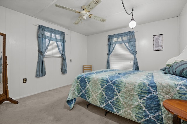 bedroom with light carpet and ceiling fan