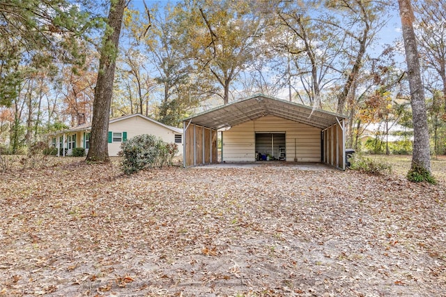 view of outbuilding featuring a carport