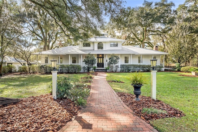 view of front of property with a porch and a front yard