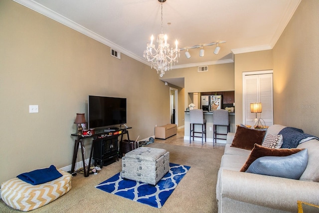 living room featuring carpet flooring, a chandelier, and ornamental molding