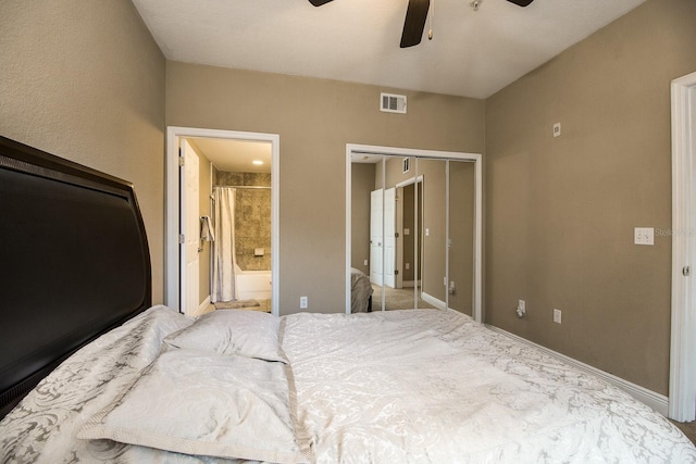 bedroom with ensuite bath, ceiling fan, and a closet