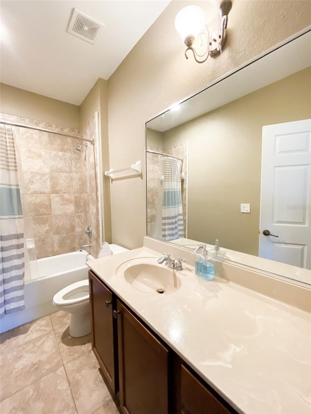 full bathroom featuring tile patterned floors, shower / bath combination with curtain, toilet, and vanity