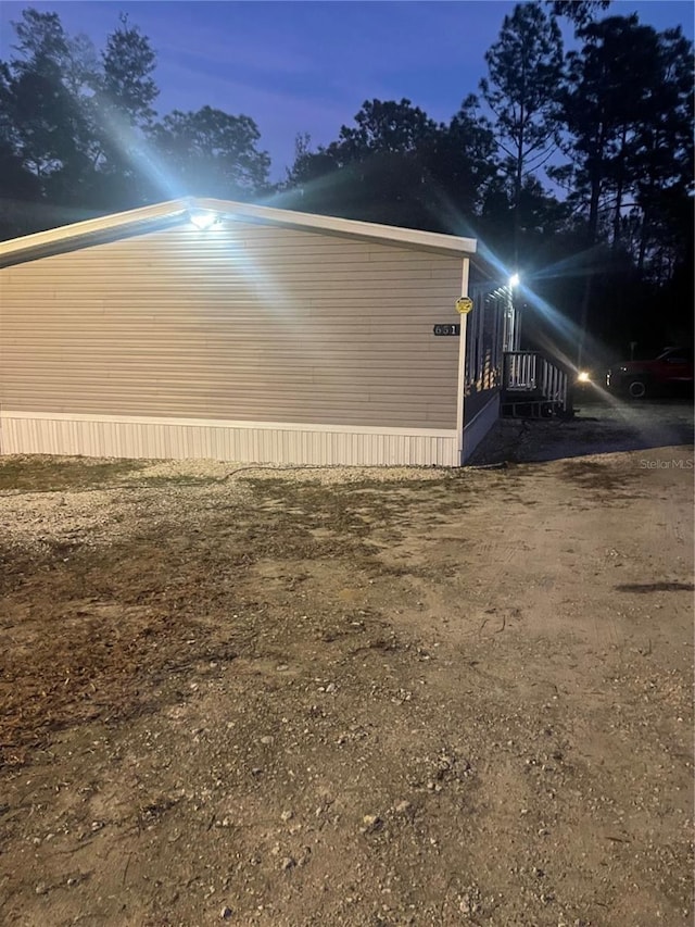 view of property exterior at dusk