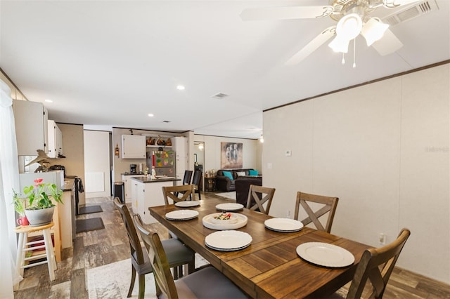 dining space with ceiling fan, dark hardwood / wood-style flooring, and billiards