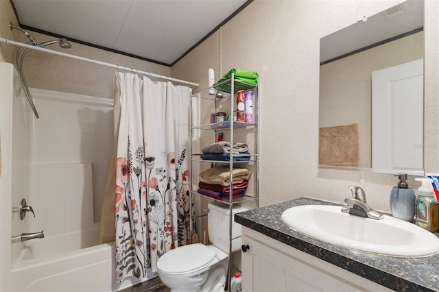 full bathroom with vanity, toilet, and shower / bath combo with shower curtain