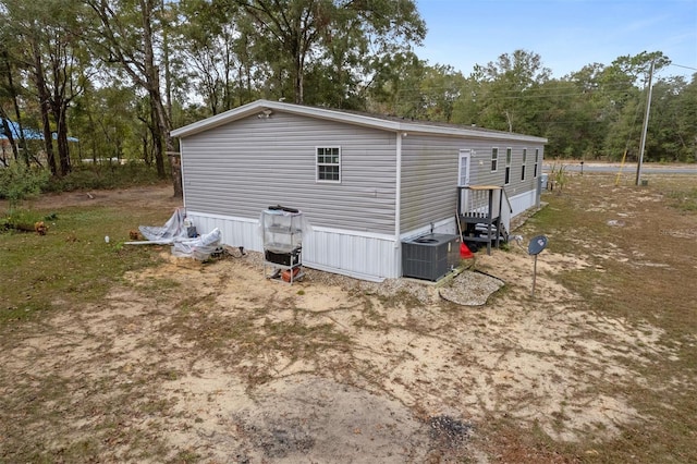 view of side of home with cooling unit