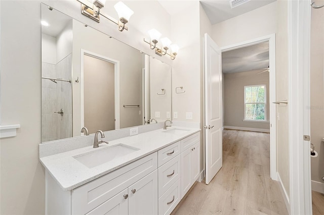 bathroom with vanity and hardwood / wood-style flooring